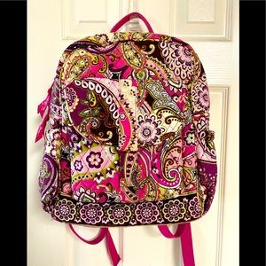 Vera Bradley w/pockets on each side and a big front compartment